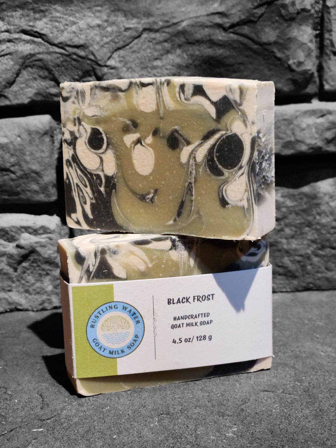 Bar of soap with a decorative pattern on a stone surface